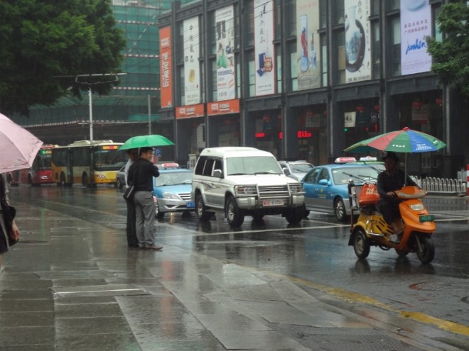 By this time it was pouring rain, but since Lim and Nan are both perfect gentlemen I waited under cover while they sought a cab.  