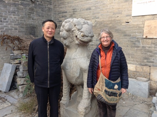 Nan’s father and I with a Ching Dynasty Lion. The Lion is eyeing up my handbag thinking I have catnip in it